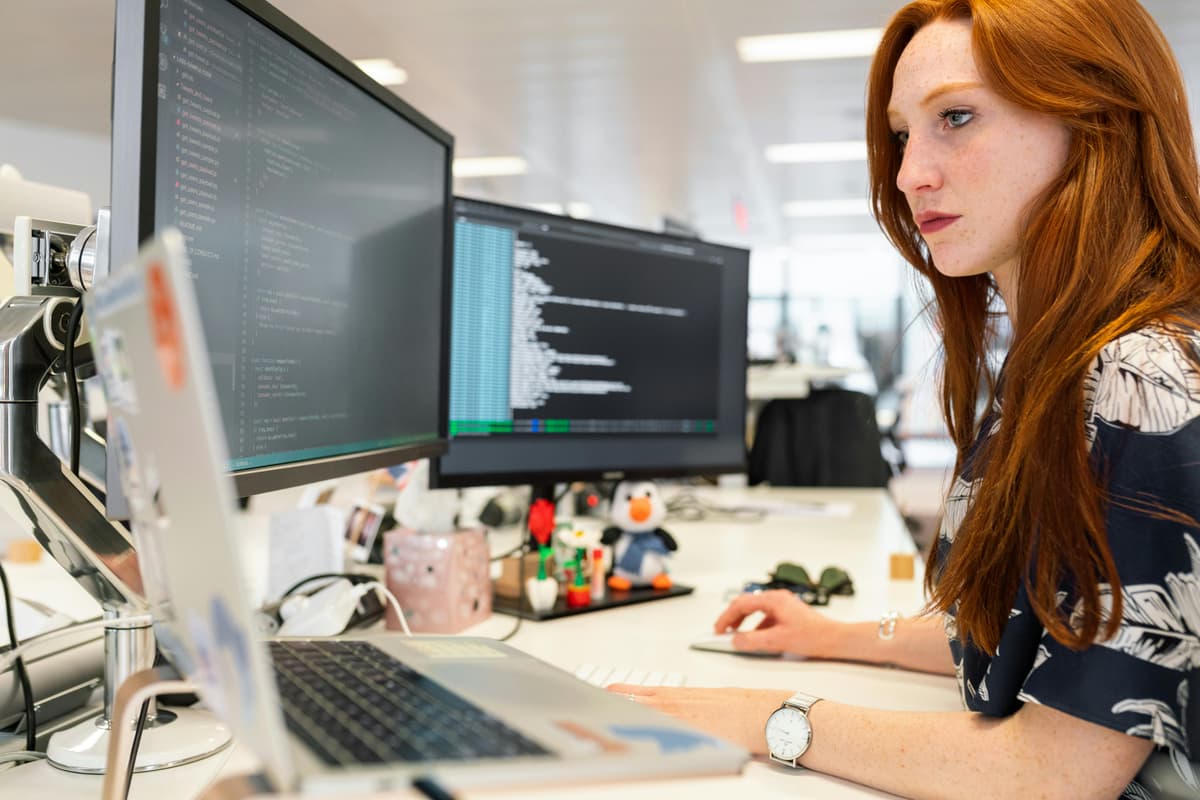 Professional software developer working on code - Butcher Business Services
